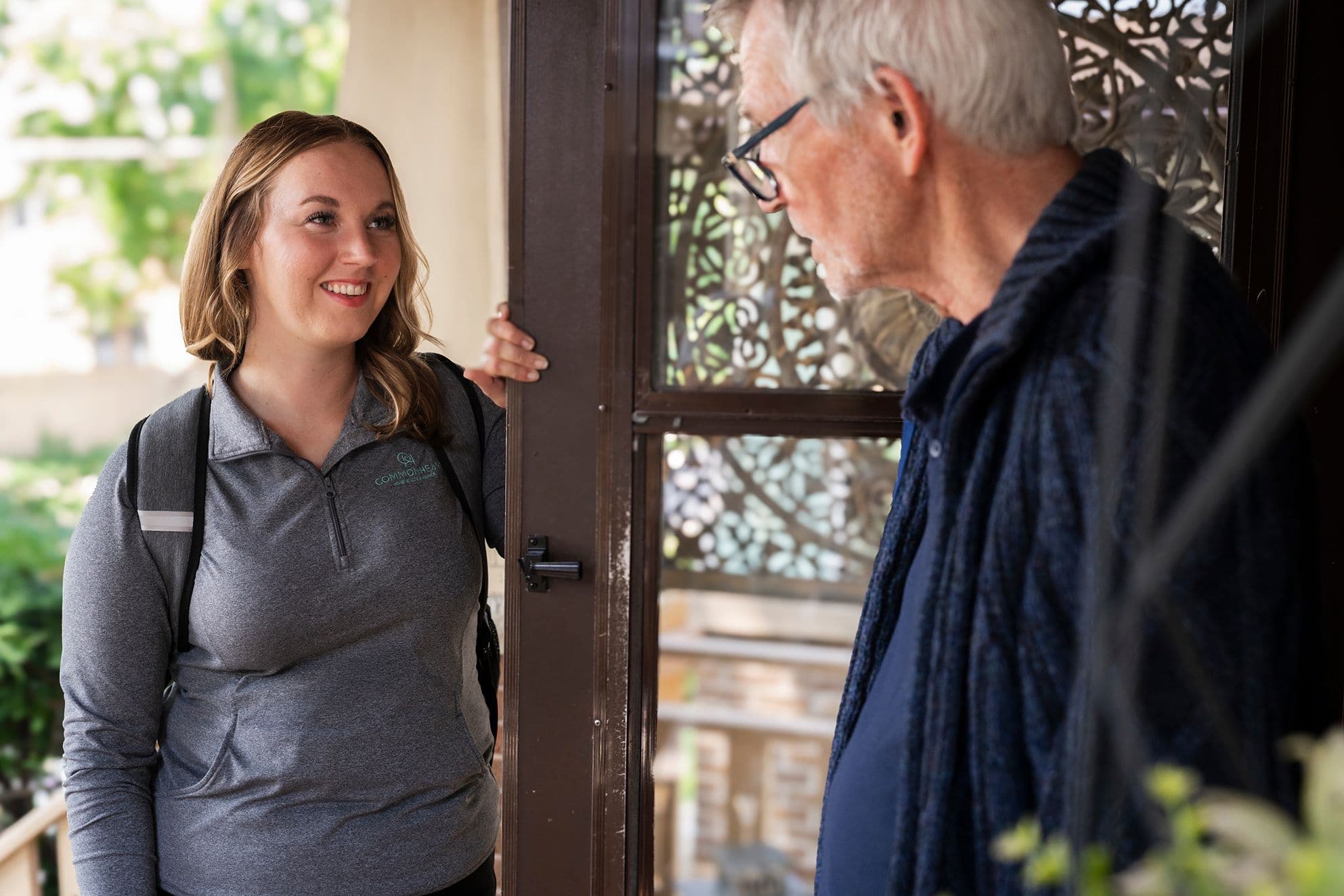 A Commonheart Hopsice nurse coming to the door of a patients house